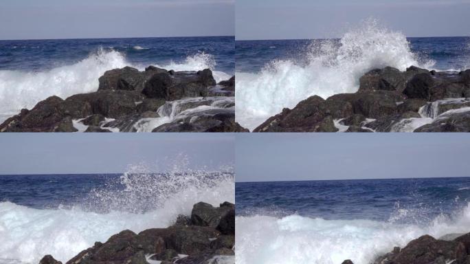 海浪在岩石海岸的石头上飞溅，缓慢的喷雾