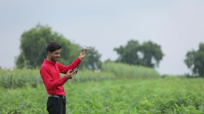 印度农艺师在农业领域手持无人机和遥控
