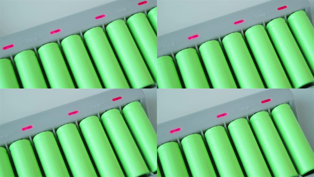 充电器里有很多绿色的锂离子电池。滑行视图