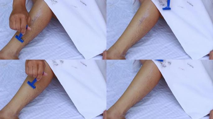 亚洲女性剃刀剃腿的特写镜头。身体护理和脱毛概念。