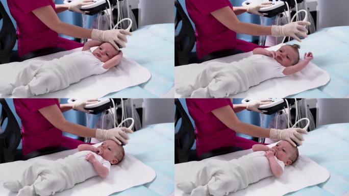 一名女医生在诊所使用现代医疗设备对新生婴儿的头部和大脑进行超声检查。儿科与儿童身体发育的控制
