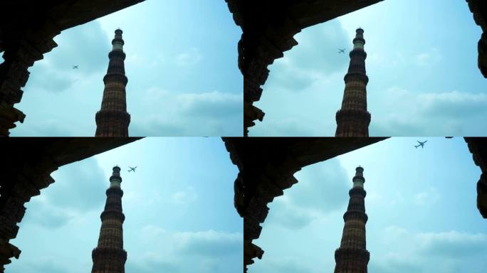 从古代结构的石柱看Qutub Minar。