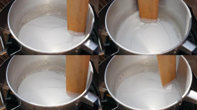 将椰奶倒入锅中。一步一步煮汤姆山药汤。泰国菜。特写。4k