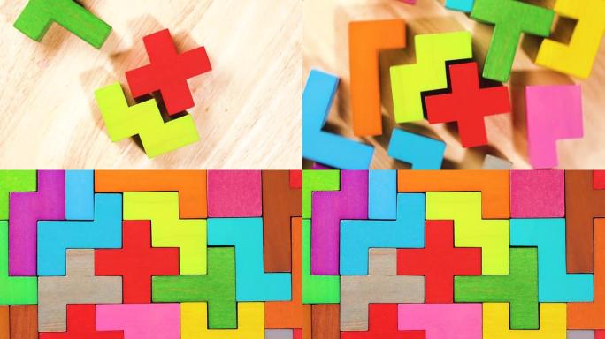 彩色木块折叠在木制背景上的俯视图。逻辑思维的概念。统一的概念。
