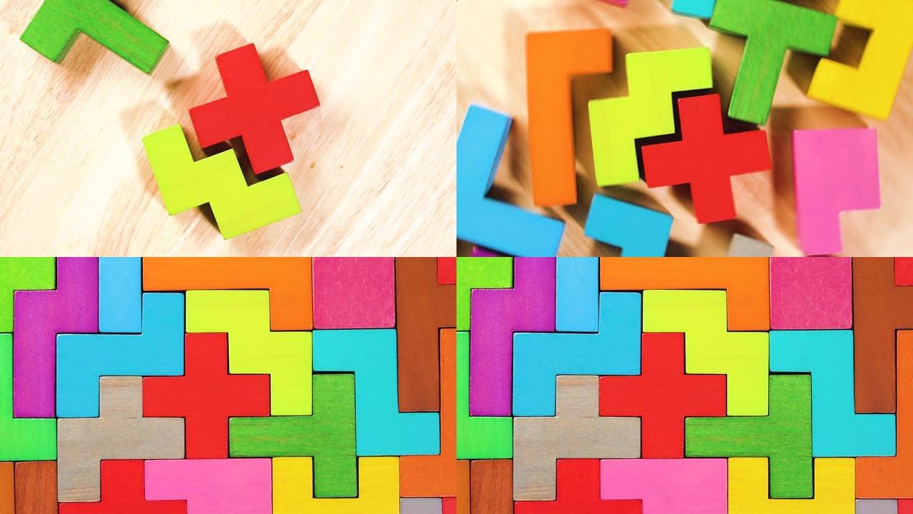 彩色木块折叠在木制背景上的俯视图。逻辑思维的概念。统一的概念。