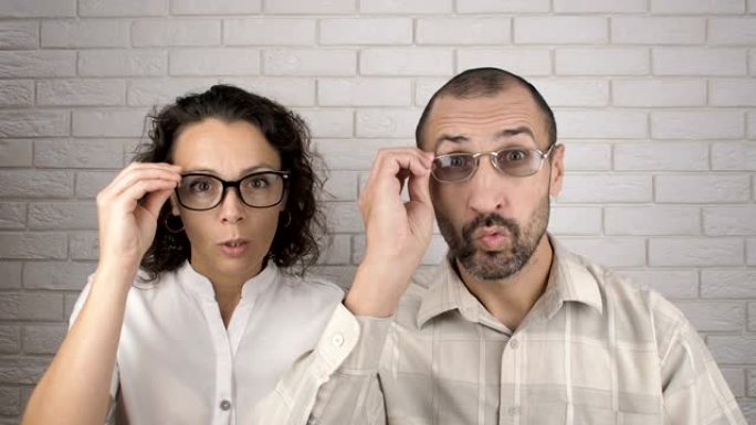视力不好。男人和女人戴眼镜。