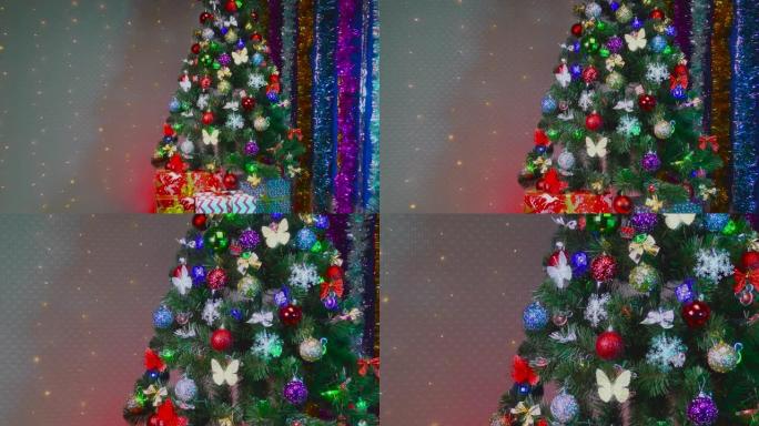 背景上闪烁灯泡的圣诞树礼物和装饰品