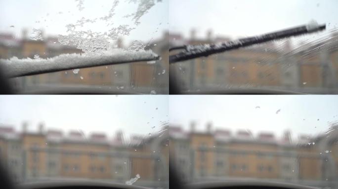 挡风玻璃雨刮片在冬季以慢动作清除挡风玻璃上的积雪