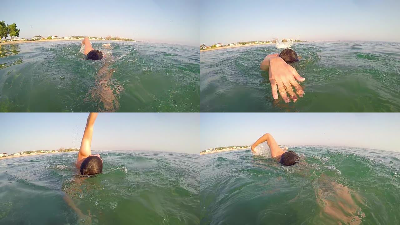 运动员游泳运动员在马拉松比赛中爬进海洋，慢动作