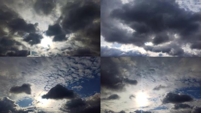 美丽戏剧性的蓬松云快速移动。蓝色多雨，天空背景多云，延时4k。太阳破了。