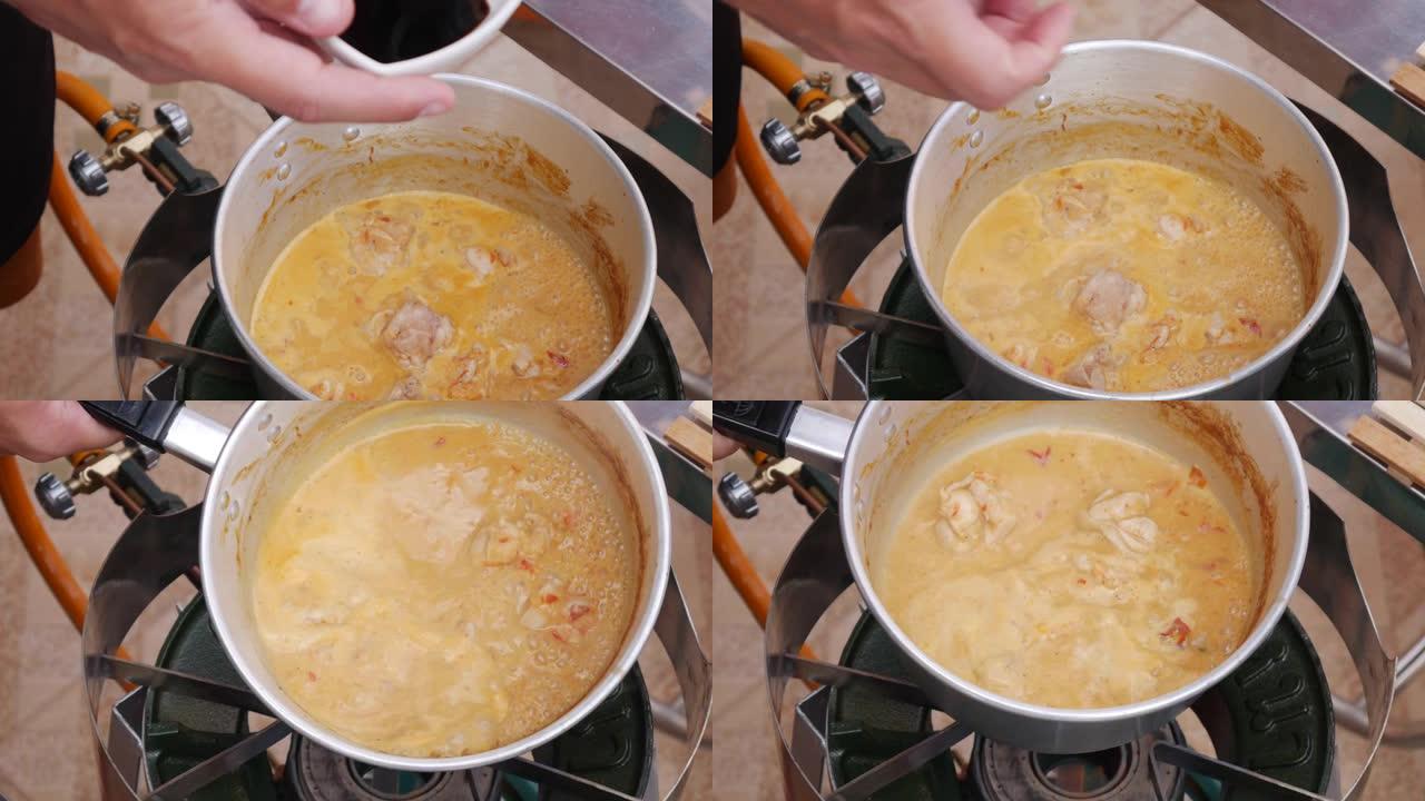 库克在沸腾的泰国辣汤中加入酱油。一步一步煮汤姆山药汤。泰国菜。特写。4k
