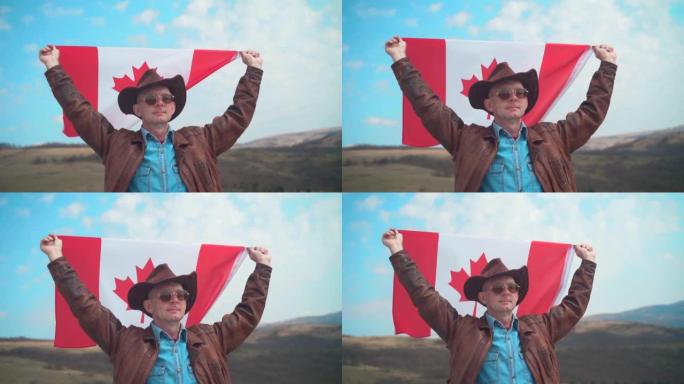 一个戴着帽子和太阳镜，皮夹克和牛仔裤的男人举着加拿大国旗。