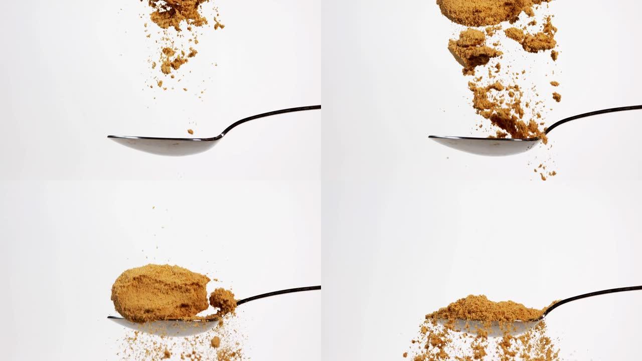 生姜，姜，白色背景下落在勺子上的粉末，慢动作4K