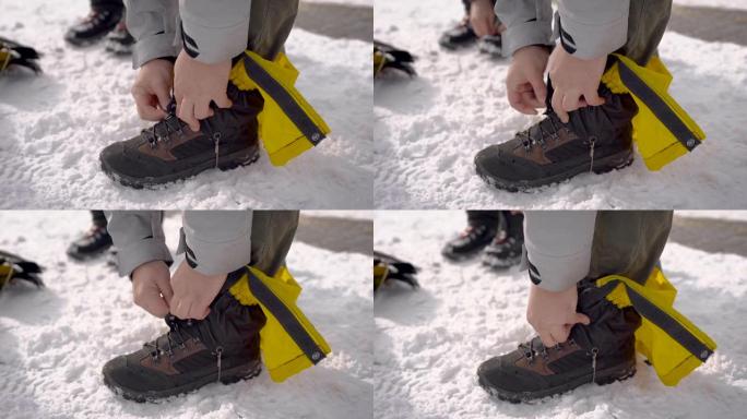 徒步旅行者的户外特写镜头在他的腿上加了一些防冻保护