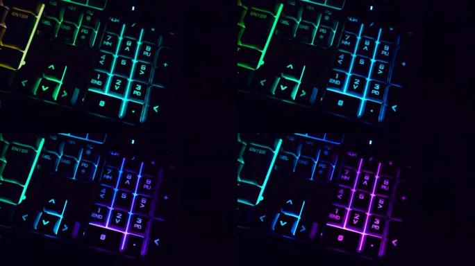 特写背光键盘细节在黑暗中闪烁RGB