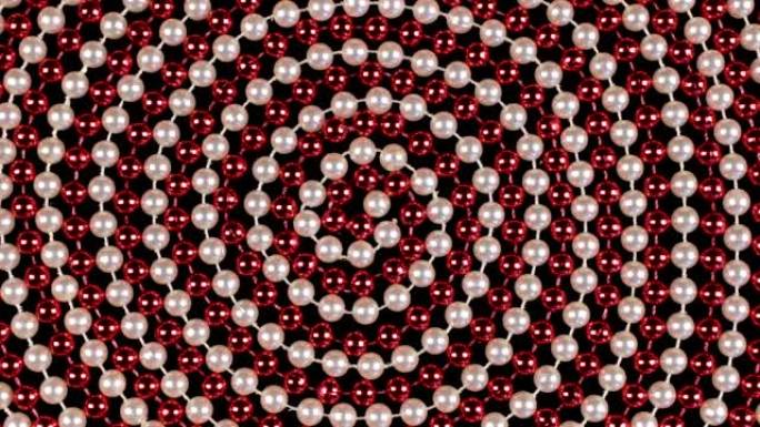 在黑色背景上旋转由红色和白色珠子制成的螺旋。