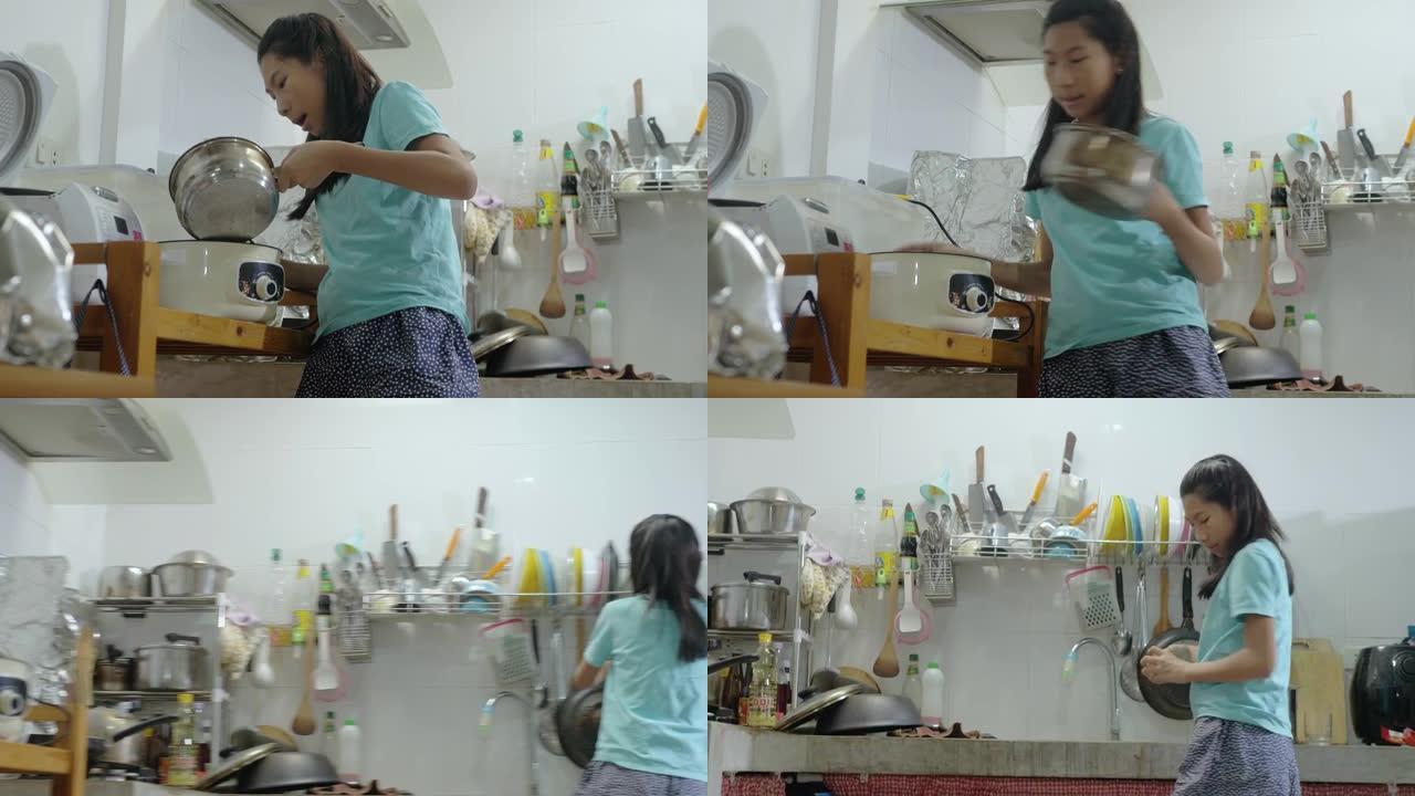 快乐的亚洲女孩在锅里倒水，自己准备食物，生活方式理念。