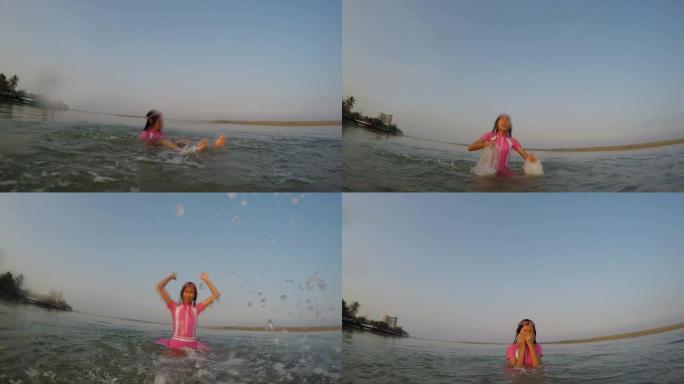 快乐的亚洲女孩穿着泳衣在沙滩上享受阳光。生活方式概念。