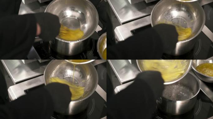 通过在鸡蛋中加入融化的黄油并搅拌来制作荷兰酱。高级美食概念