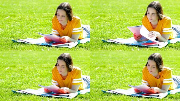 学生在草地上学习学习笔记