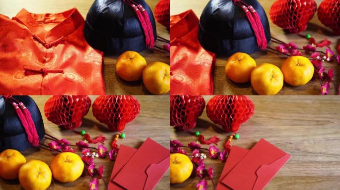 木色背景上的橘子、红灯笼和中国红包