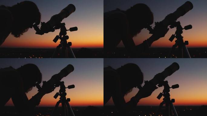 女孩通过望远镜看着黄昏的天空。