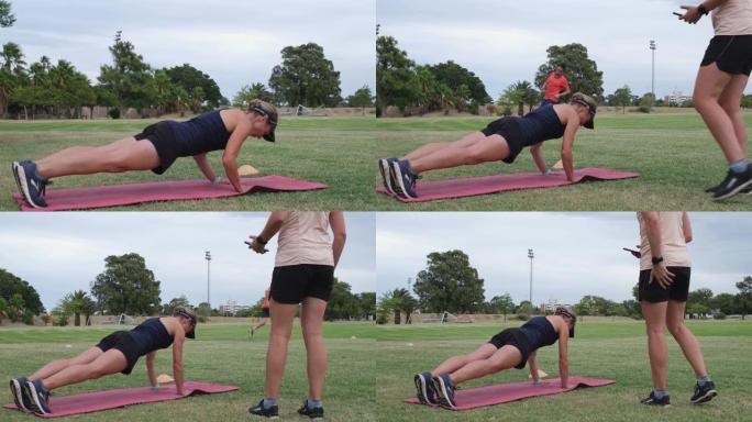 健身教练在露天场地上领导体育课
