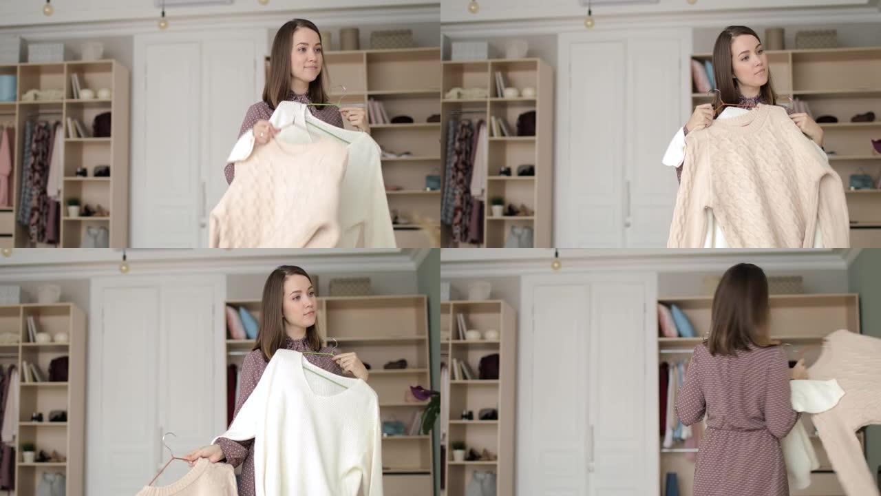 穿着裙子的女人在家里的衣柜里试着穿两件毛衣。