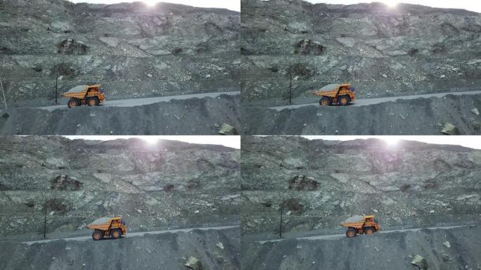 装有粉笔的自卸车在采石场路上行驶。采石场和采矿设备