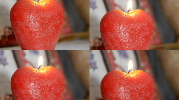 装饰。苹果形式的燃烧蜡烛的全景。