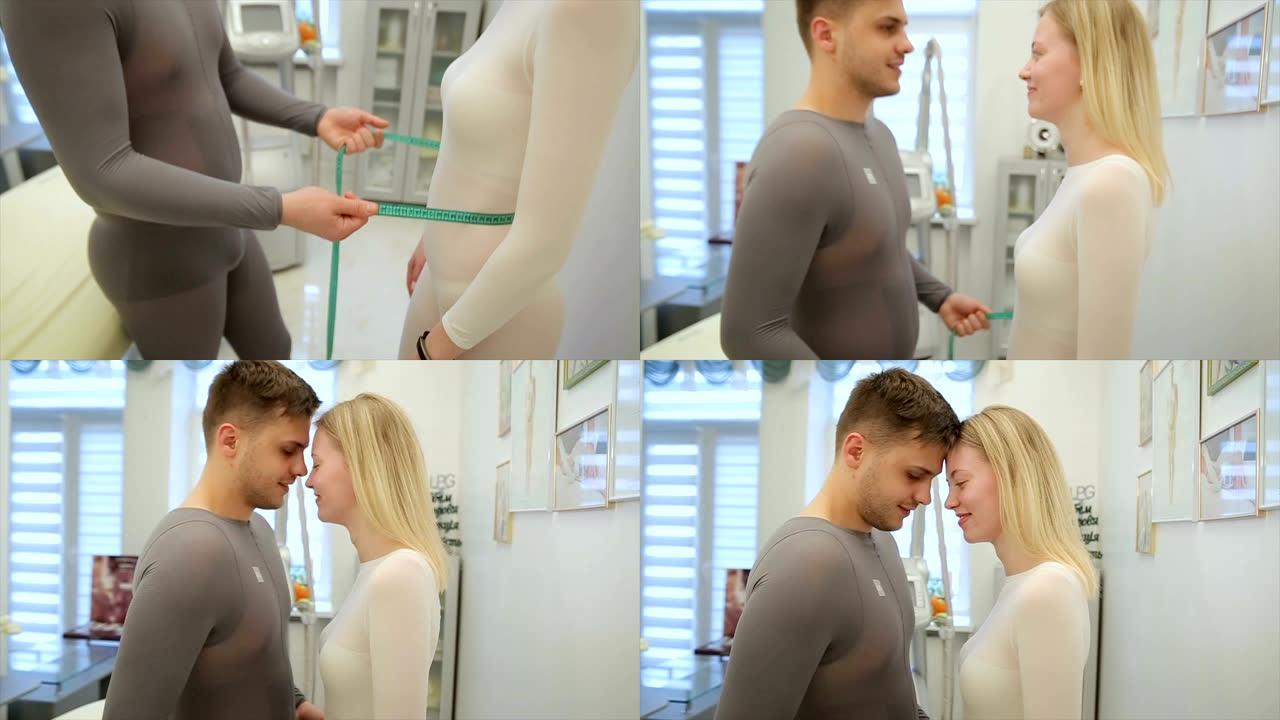 在美容院与她一起手术后，男孩用绿丝带给他的女孩测量腰部
