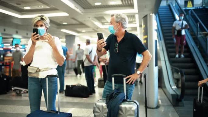 冠状病毒大流行期间，一对中年夫妇在机场。