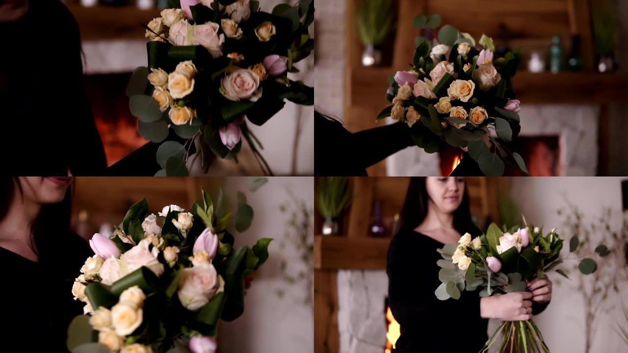 专业女性花卉艺术家，花店拿着美丽的玫瑰花，在工作坊里用柔和的色彩郁金香。花艺、手工制作和小型企业概念
