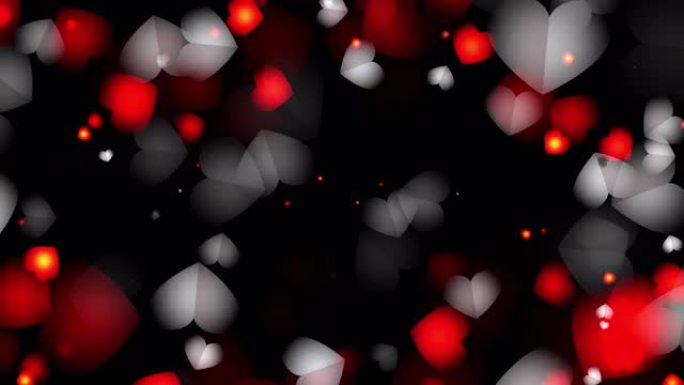 抽象发光的红色和白色心脏粒子褪色在黑屏背景循环动画中漂浮。4K 3D循环。母亲节、婚姻、情人节、婚礼