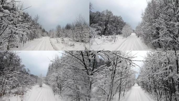 乘坐越野车穿越冬季森林的POV之旅 -- 回顾一下。冬天雪林的美丽景观。冬天开车旅行