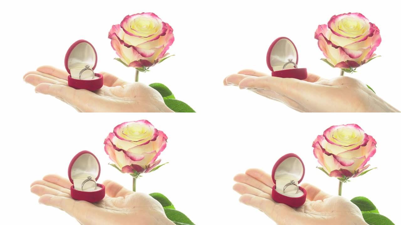 在礼品盒中展示美丽的玫瑰和戒指，呈心形。4k