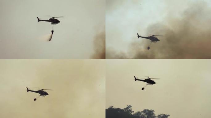消防直升机在森林大火中滴水