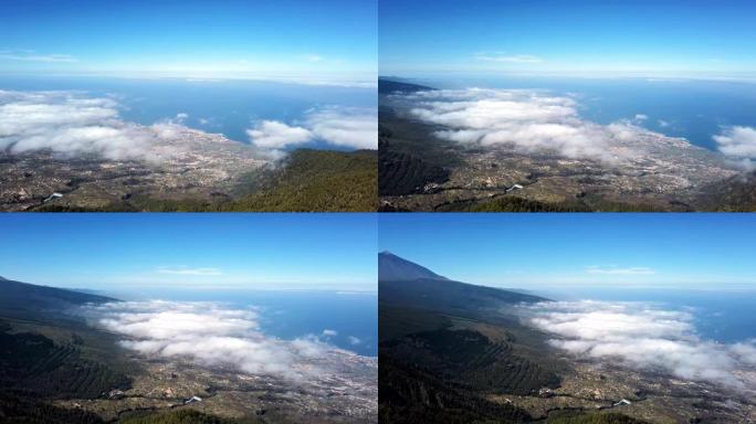 云层的空中全景覆盖了西班牙加那利群岛特内里费岛的拉克鲁斯港和泰德国家公园。