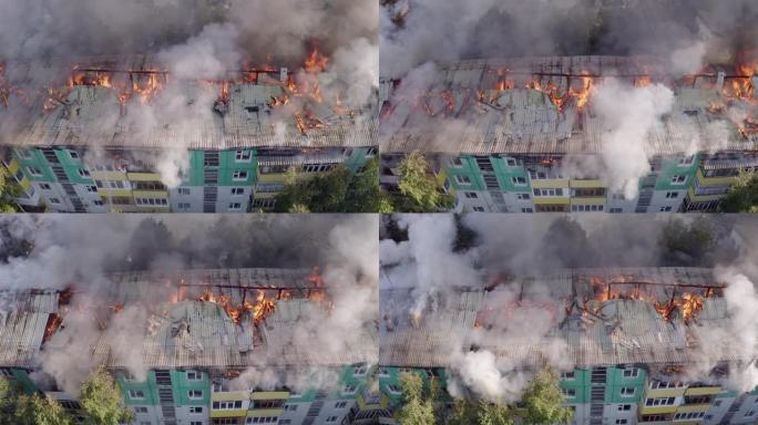 一栋住宅的屋顶正在燃烧。消防员扑灭了一座住宅高层建筑屋顶的大火。