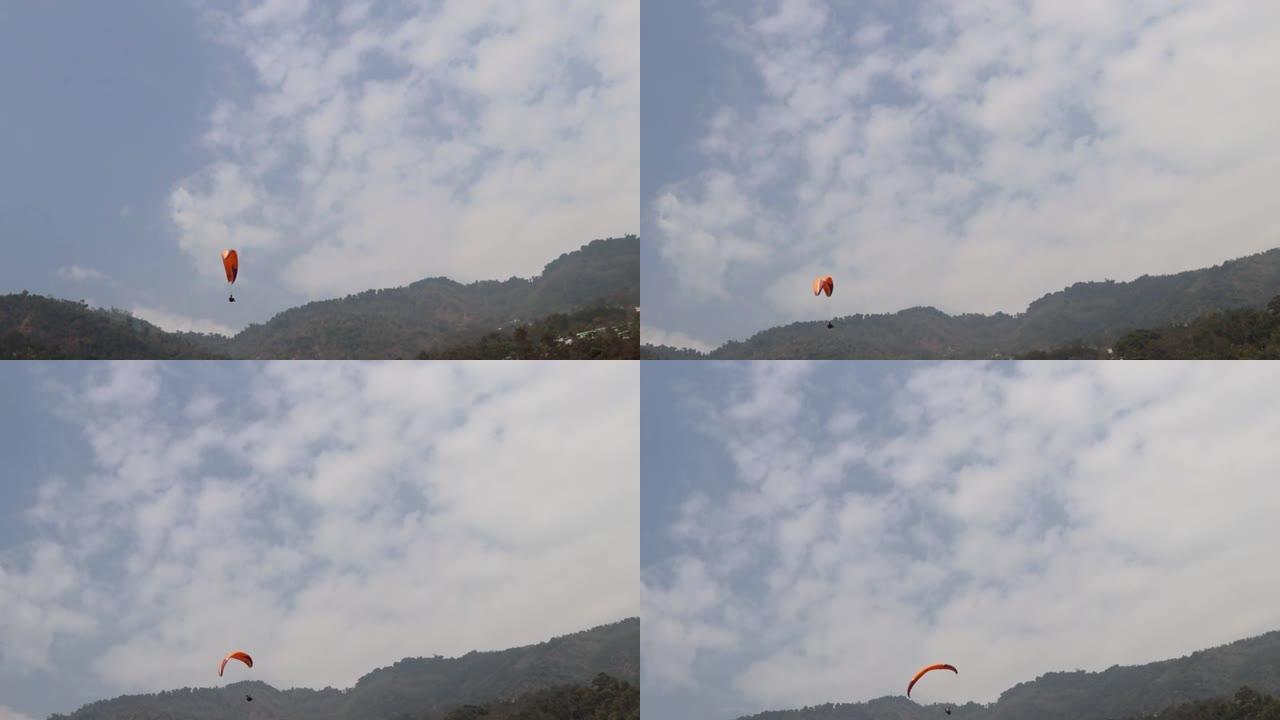 Para滑翔机在喜马拉雅山脉的背景下飞行，在印度锡金甘托克市滑翔伞