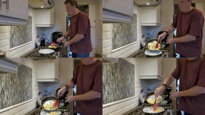 男子用硅胶刮刀将炒鸡蛋放在盘子上