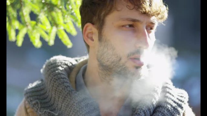 一个男人吸烟的特写镜头