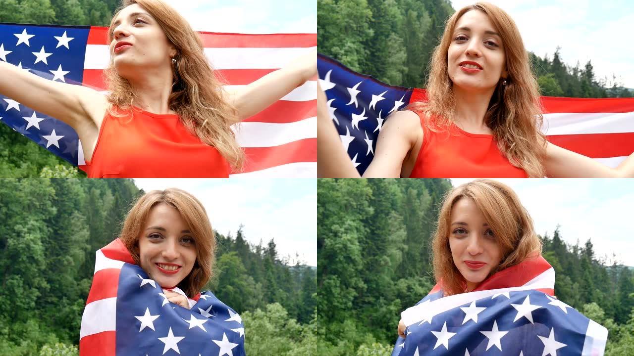 近距离的肖像快乐的情绪化的女人与美国国旗在绿色的森林背景在夏季白天户外。美国庆祝七月四日。