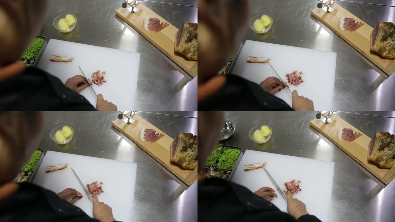 厨师在切菜板上切烟熏火腿