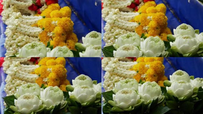 祭坛用花环。在市场摊位上出售用于祭祀的各种花环