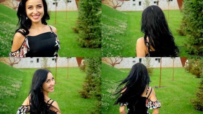 快乐微笑的黑发女人在绿色草地上的夏季公园里逃离相机