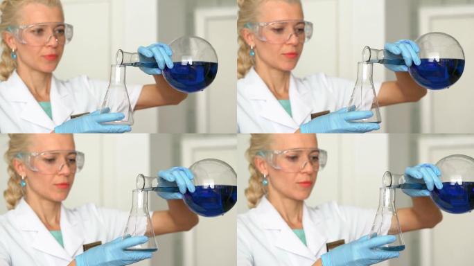 专注的年轻生命科学专业移液到玻璃比色皿中。镜头聚焦在研究人员的眼睛上。高清
