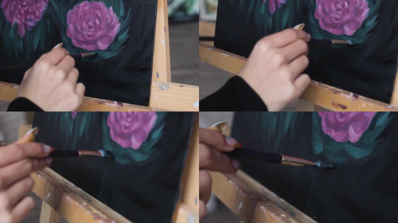 华丽的粉红色头发的女艺术家在艺术工作室里用调色板在艺术项目中工作。年轻女子画了一幅画