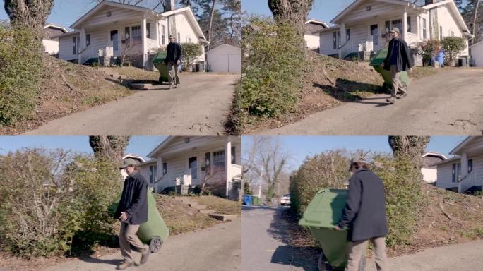 冬天，一名男子将垃圾桶走到路边的尽头