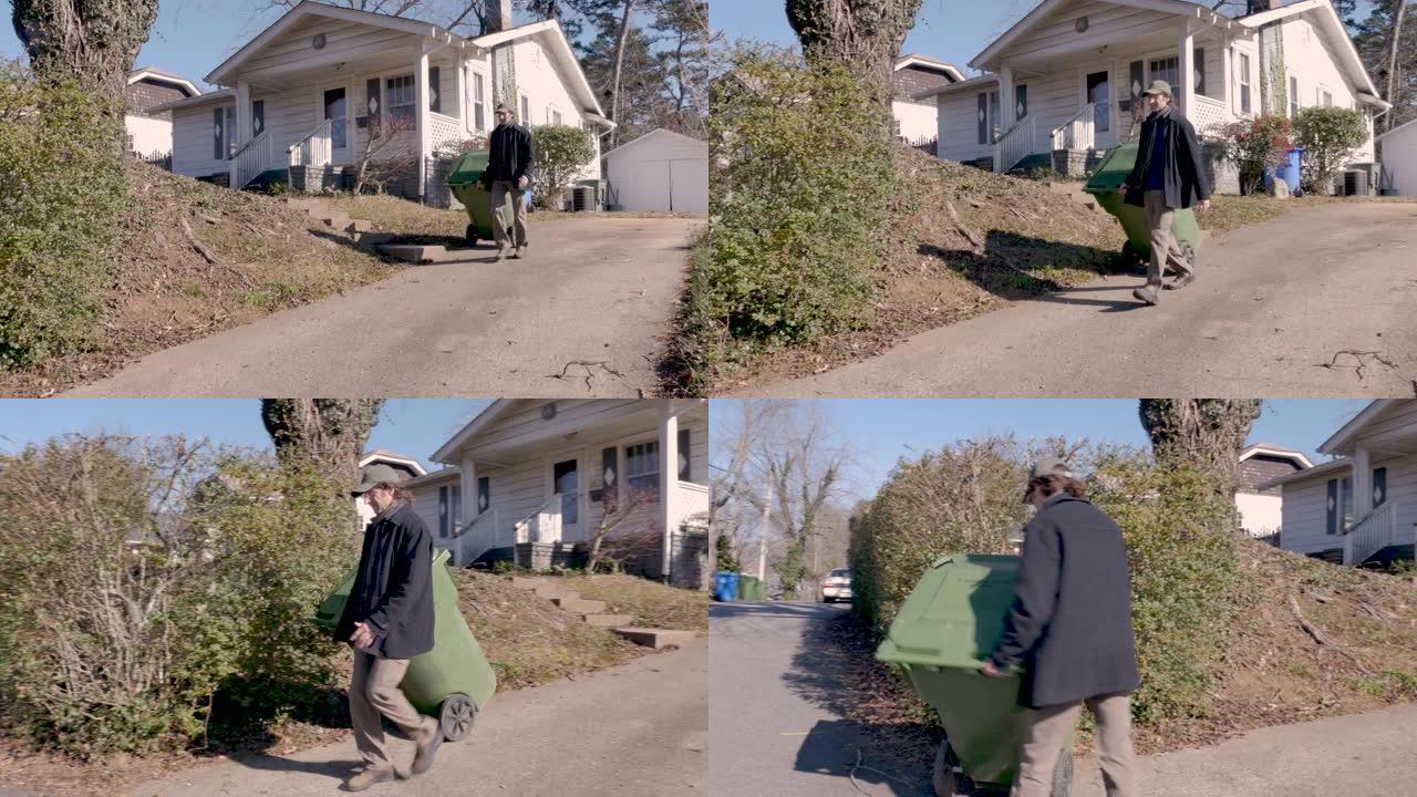 冬天，一名男子将垃圾桶走到路边的尽头